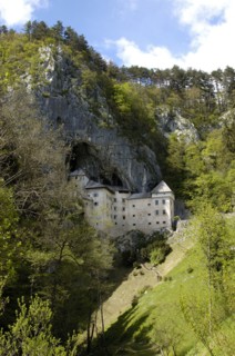 SLOVENIA, Predjama Castle, 16th Century castle built half way up 123M high cliff