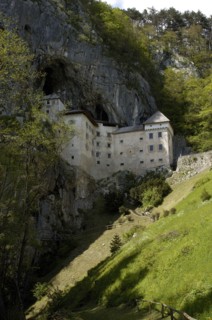 SLOVENIA, Predjama Castle, 16th Century castle built half way up 123M high cliff
