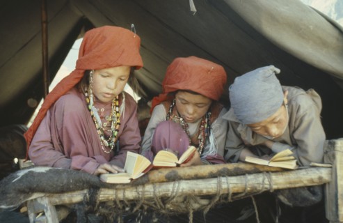 AFGHANISTAN, Children, Kirghiz children studying the Koran.