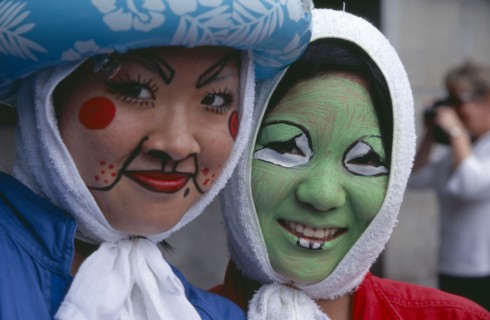 JAPAN, Honshu, Tokyo, Harajuku District. Portrait of two smiling girls wearing face paint