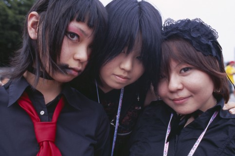 JAPAN, Honshu, Tokyo, Harajuku District. Portrait of three girls dressed in teenage Japanese style