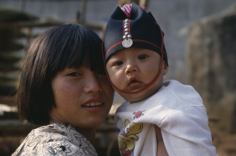 THAILAND, North, Portrait of two Akha tribe children near Chiang Rai.