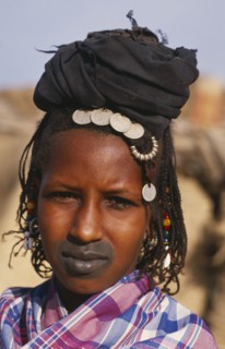 MALI, Tribal People, Head and shoulders portrait of Fulani woman with tattooed lips and wearing