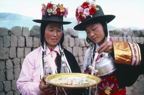 CHINA, Qinghai Province, Huzhu County, Women of Tu nationality and Lamaist Buddhist Yellow Hat sect