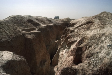 BURKINA FASO, Sahel, Landrover on ridge of land above old gold workings.