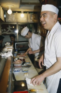 JAPAN, Honshu, Tokyo, Sushi chef at Tsukiji Market.