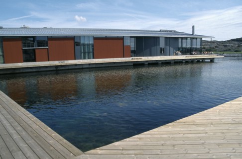 SWEDEN, Goteborg Och Bohus, Skarhamn, Water Colour Museum.  Modern building with water and wooden