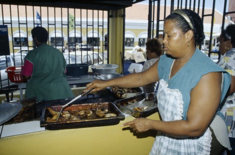 WEST INDIES, Dutch Antilles, Curacao, Willemstad.  Female cook.