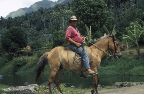 PACIFIC ISLANDS, Polynesia, French Polynesia, "Marquesas. Taipivai, Nuku Hiva.  Horserider."