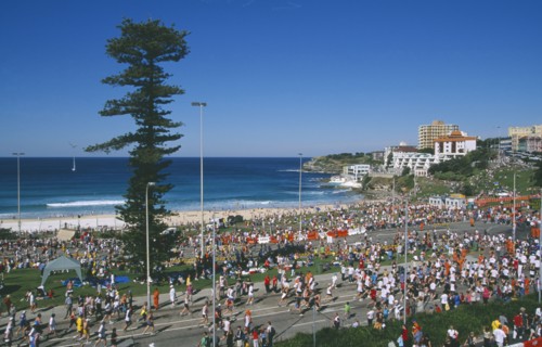 AUSTRALIA, New South Wales, Sydney, Bondi Beach.  Competitors and spectators in annual City to Surf