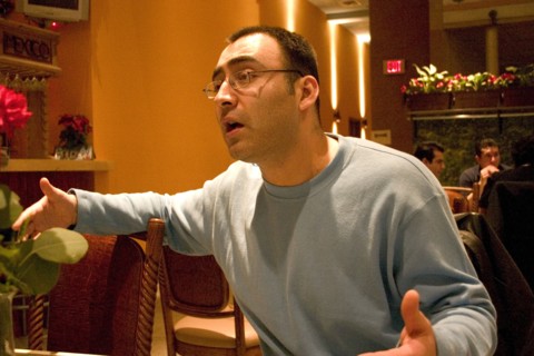 USA, Minnesota, Minneapolis, Impassioned young man talking in a restaurant.