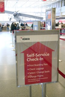 USA, Minnesota, Minneapolis, Self-Service Check-In arrow and directions sign at Minneapolis-St.