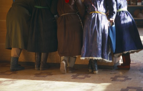 MONGOLIA, People, Cropped view of group of women standing at counter of shop.