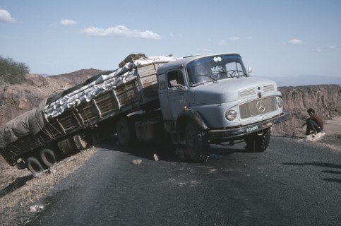 ETHIOPIA, Transport, World Food Programme lorry with trailer having slipped off the road