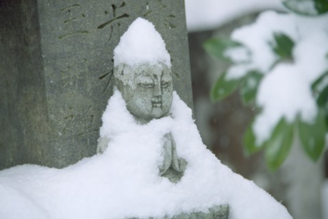 JAPAN, Fukui, Obama, Zen Buddhist grave and statue in snow.
