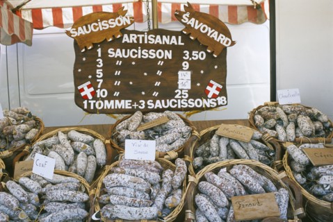 FRANCE, Rhone Alps, Haute Savoie, Samoens.  Baskets of different flavoured pork sausages for sale
