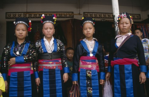 LAOS, Luang Prabang, Four Hmong girls in traditional dress.