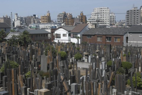 JAPAN, Honshu, Tokyo, Yanaka. View over the cemetary of Shoyomei-ji Temple closely surrounded by