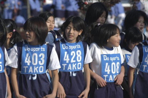 JAPAN, Chiba, Tako, 11-12 year old girls await the start of 2 kilometer race which is part of the