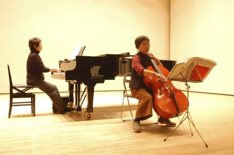 JAPAN, Chiba, Tako, 53 year old public health nurse named Teruko Ui plays cello at recital as a