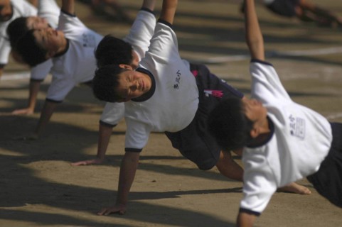 JAPAN, Chiba, Tako, Tako Elemetary School Undoukai or Sports Day. 6th grade boys perform massed