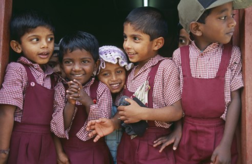 SRI LANKA, Dambetenne, Group of young school children wearing red uniform
