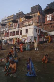 INDIA, Uttar Pradesh, Varanasi , Early morning bathers in the Ganges River by Dashaswamedh Ghat