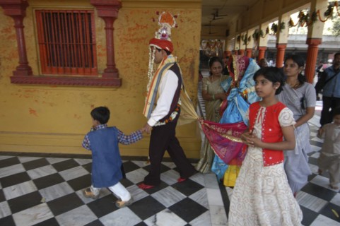 INDIA, Uttar Pradesh, Varanasi , Sankat Mochan Mandir temple. A groom walks around the temple