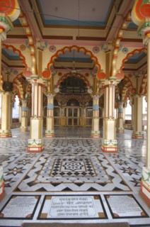 INDIA, Uttar Pradesh, Varanasi , Ram Sawmi Temple entrance with colourful columns