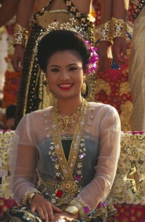 THAILAND, Chiang Mai, Portrait of young woman riding the beauty contest float in the Flower