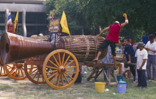 THAILAND, Chiang Mai, Cannon drum competition with drummer beating drum