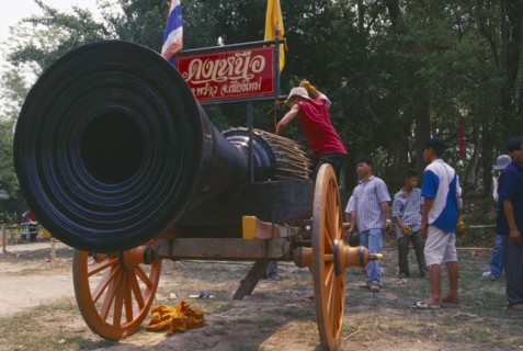 THAILAND, Chiang Mai, Cannon drum competition with drummer beating drum