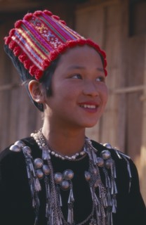 THAILAND, Chiang Mai Province, Muang Nga, Portrait of a Jinghpaw girl wearing traditional womans