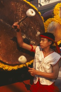 THAILAND, Chiang Mai, Traditional Thai drummer with large drum in the Flower Festival parade