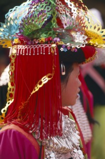 THAILAND, Chiang Rai Province, Huai Khrai, Portrait of a young Lisu woman in her New Year finery