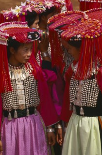 THAILAND, Chiang Rai Province, Huai Khrai, Lisu women dressed in their New Year finery turned