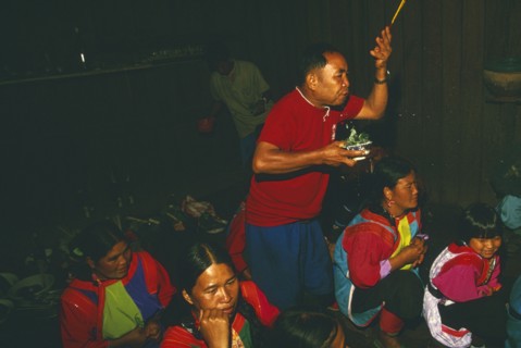 THAILAND, Chiang Rai Province, Doi Lan, New Year. Shaman performing ceremony to cure villagers