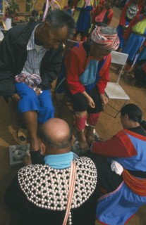 THAILAND, Chiang Rai Province, Huai Khrai, New Year. Lisu people paying respects to their elders by