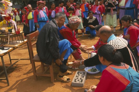 THAILAND, Chiang Rai Province, Huai Khrai, New Year. Lisu people paying respects to their elders by