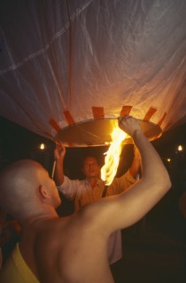 THAILAND, Chiang Mai, Mae Jo San Sai District, Loi Krathong Festival aka Yi Peng. Monk and another