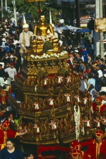 THAILAND, Chiang Mai, Songkran aka Thai New Year. Buddha image in lustration parade near Wat Phra