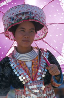 THAILAND, Chiang Mai, Hmong New Year. Young white Hmong woman in her New Year finery