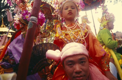 THAILAND, Chiang Mai, Shan Poi San Long. Crystal Children ceremony with Luk Kaeo in costume sitting