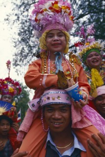 THAILAND, Chiang Mai, Shan Poi San Long. Crystal Children ceremony with Luk Kaeo in costume sitting