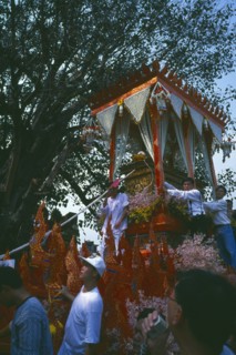 THAILAND, Chiang Mai, Revered monks funeral procession to cremation grounds with people pulling the