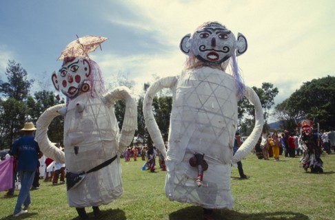 THAILAND, Loei Province, Dan Sai, Phi Ta Khon or Spirit Festival. People wearing a pair of male and