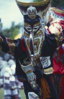 THAILAND, Loei Province, Dan Sai, Phi Ta Khon or Spirit Festival. Person wearing spirit mask