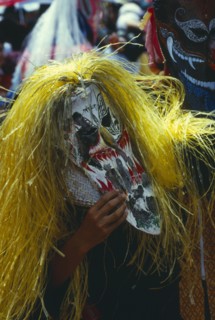 THAILAND, Loei Province, Dan Sai, Phi Ta Khon or Spirit Festival. Person wearing elaborate spirit