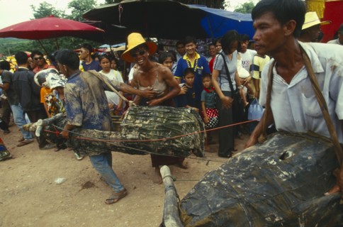 THAILAND, Loei Province, Dan Sai, Phi Ta Khon or Spirit Festival. Two men in water buffalo costumes