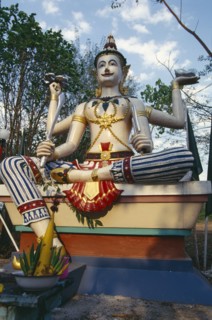 THAILAND, Chiang Mai, Wat Bahn Pueng Fang, Statue of Siva holding trident conch shell sword and